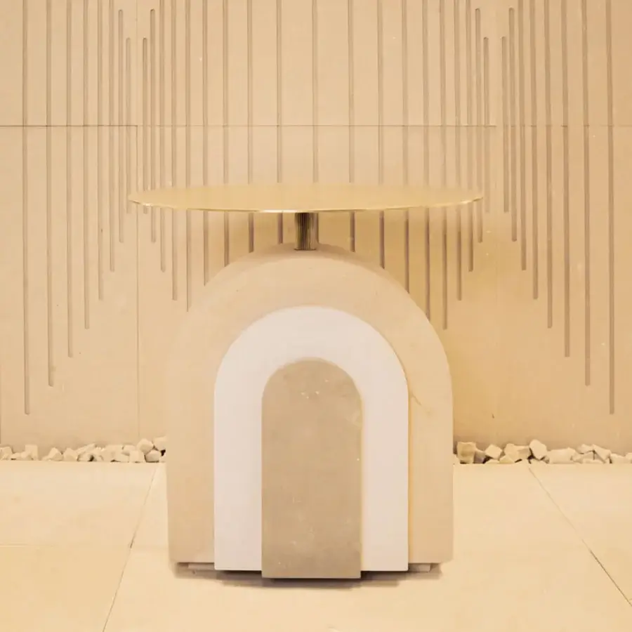 Exquisite contemporary PIMAR Arco coffee table with stacked beige cream stone base, gold satin finish top, fluted metal central column