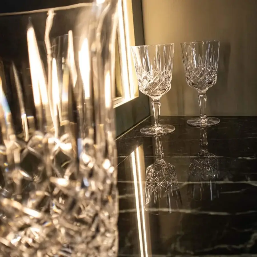 Sophisticated Agresti Peninsula bar cabinet featuring a wavy silhouette with polished brass accents and marble top