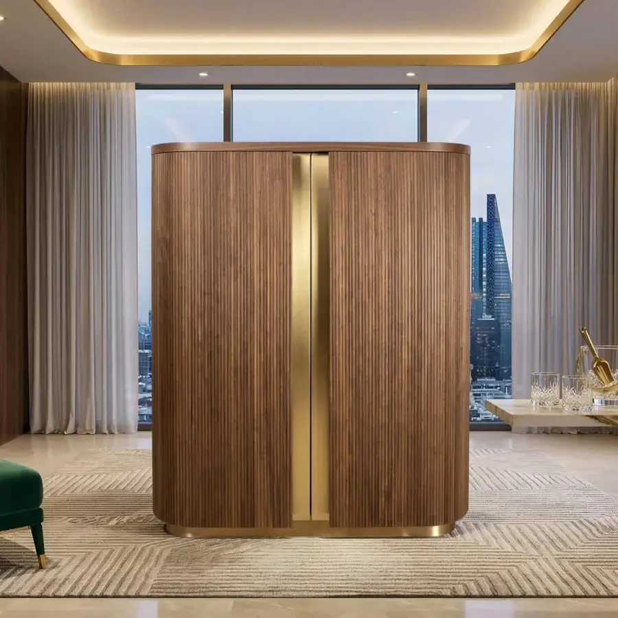 Sophisticated Agresti Peninsula bar cabinet featuring fluted wood, polished brass, satin-gold base, and marble top