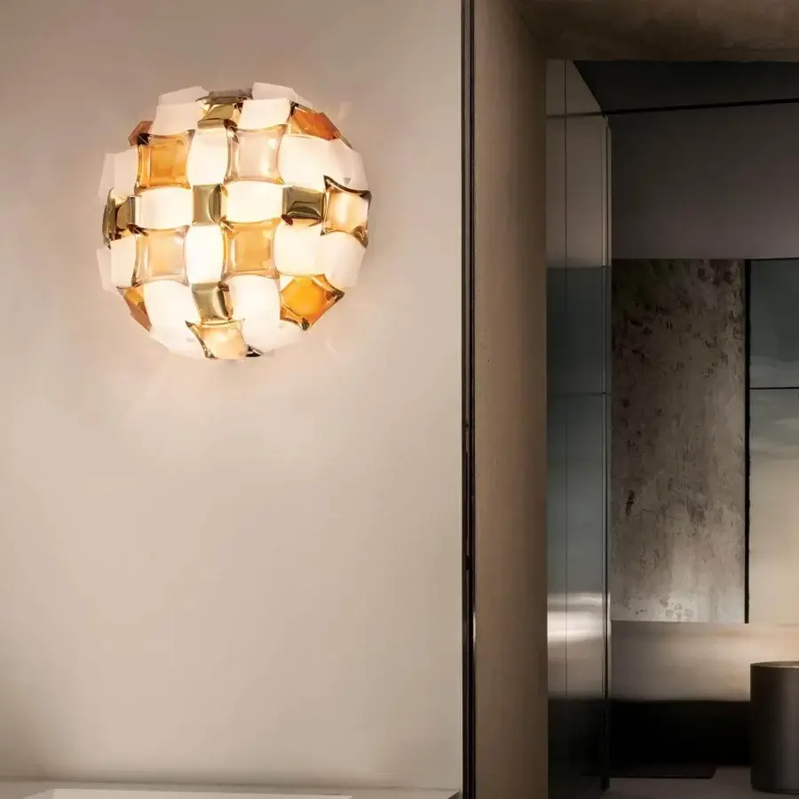 Lavish Slamp Mida wall lamp crafted in white Opalflex® and printed Lentiflex® with glossy gold gems and silky stones