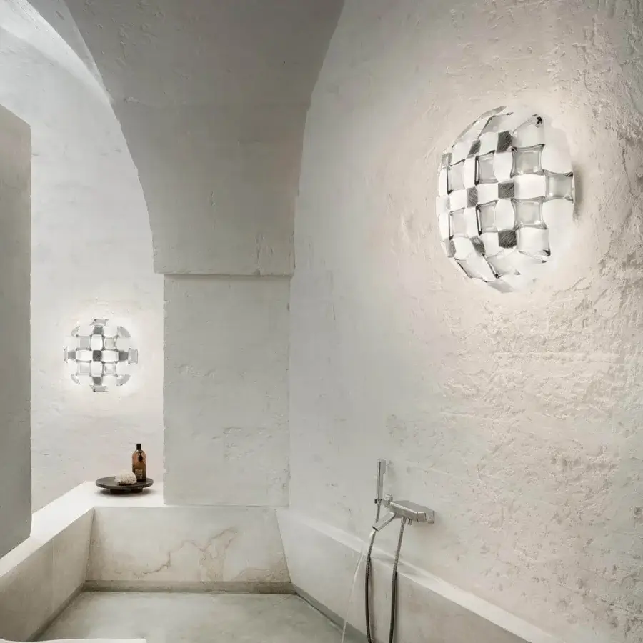 Distinguished Slamp Mida wall lamp showcasing a pavè of geometrically scattered gems in white Opalflex® and printed Lentiflex®