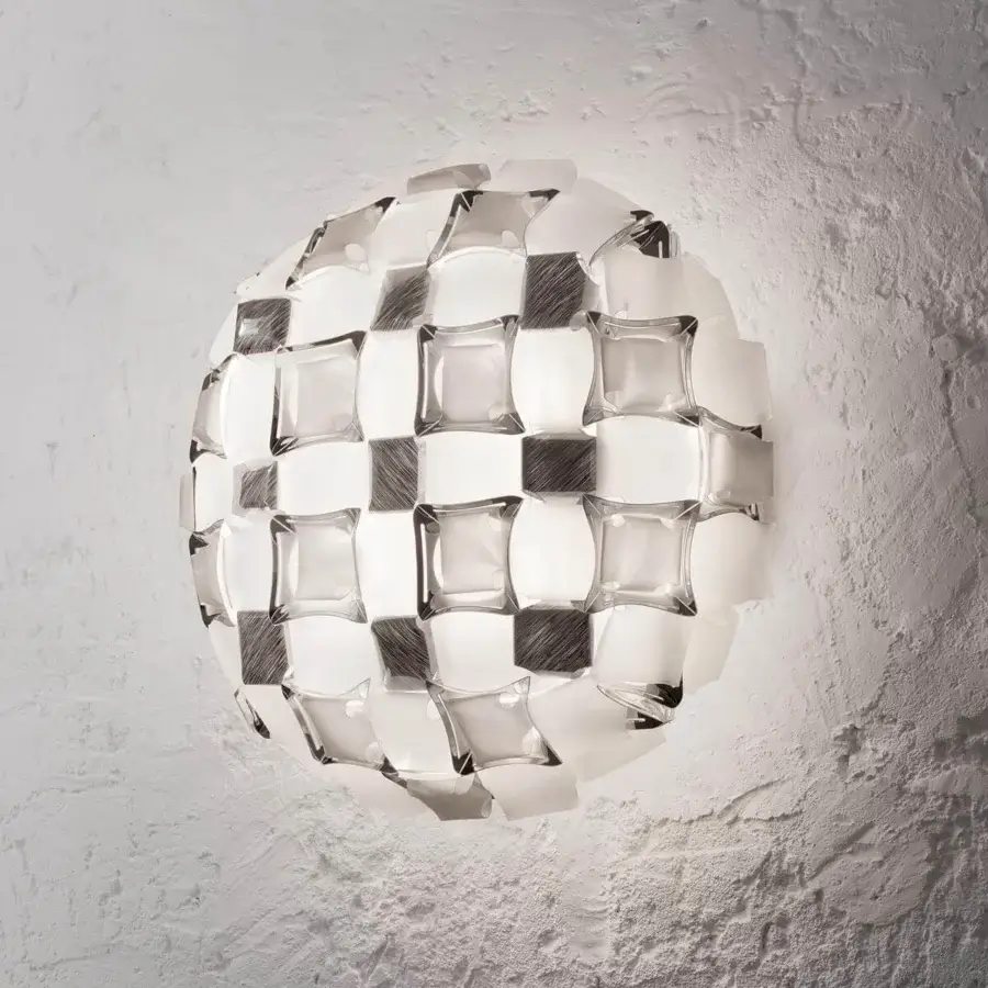 Lavish Slamp Mida wall lamp handcrafted in white Opalflex® and printed Lentiflex® with geometrically arranged dark gray and white cabochons