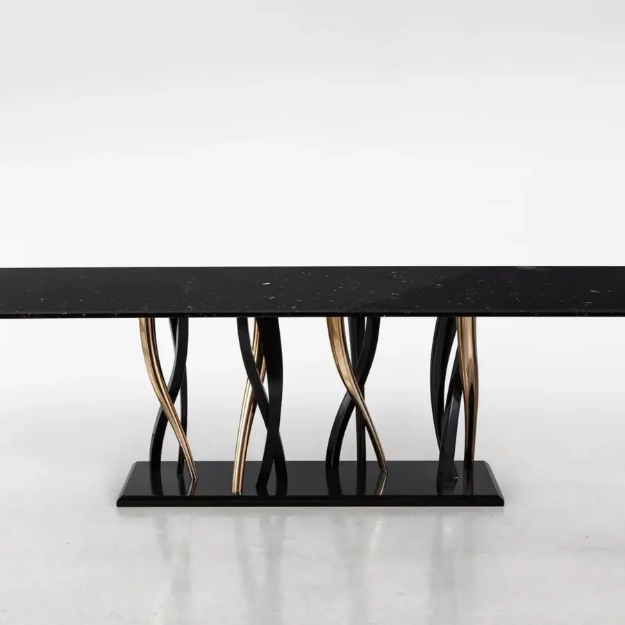 Distinguished Il Pezzo Mancante table with black Marquinia marble and intertwined black gold finished legs