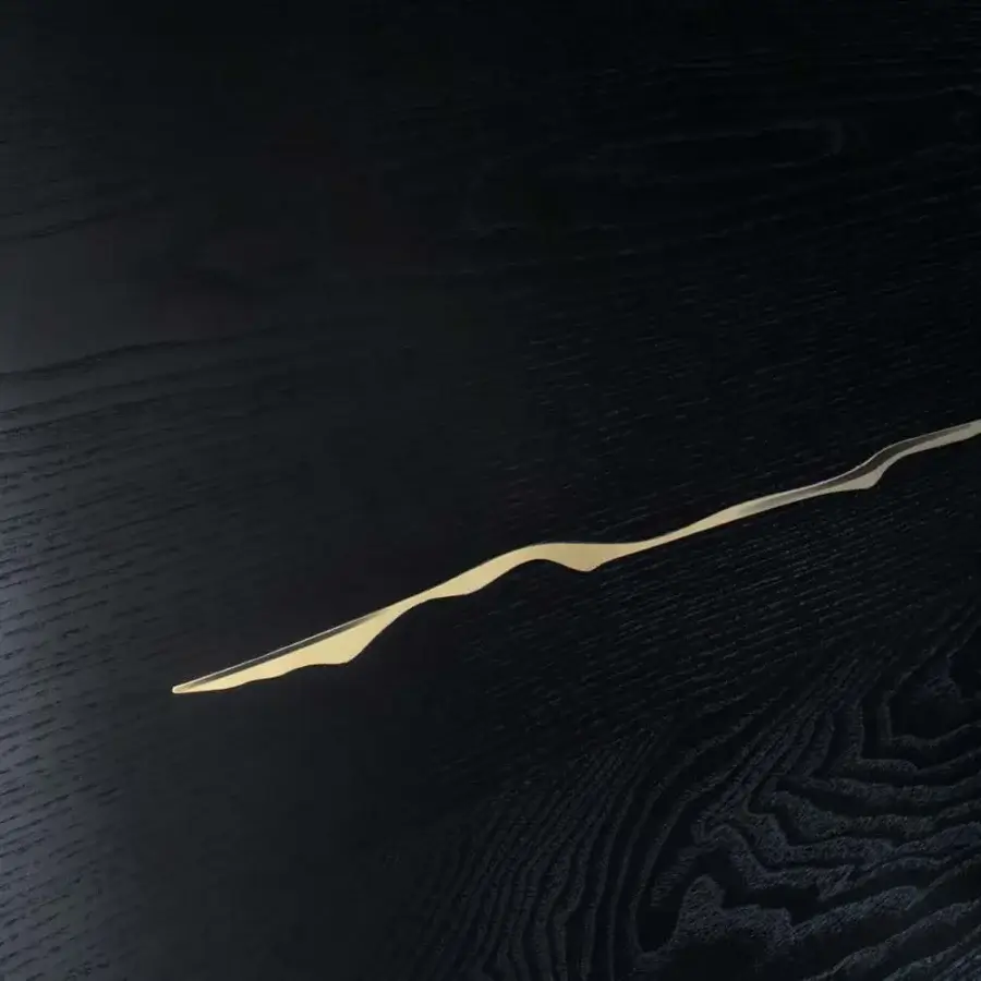 Exceptional Il Pezzo Mancante Il Pezzo 8 table crafted with black stained oak and winding inlay in a lighter tone with black and gold aluminum legs