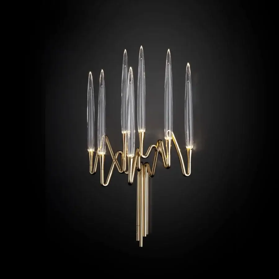 Exquisite Il Pezzo Mancante wall lamp in hand-forged brass holding clear crystal elements with a gold-toned ornate finish
