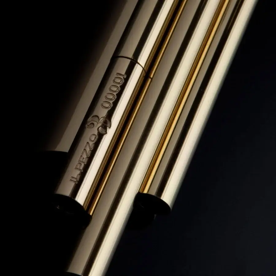 Lavish Il Pezzo Mancante wall lamp crafted in hand-forged brass with clear solid crystal cylinders and reflective golden finish