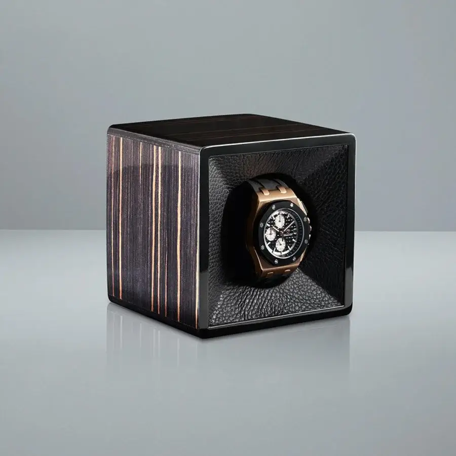 Luxury Agresti Tempo Unico watch winder in cubic wood with dark vertical striped grain plus high-gloss reflective finish