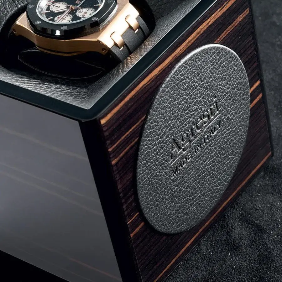 Exquisite Agresti Tempo Unico watch winder accessory featuring dark wood trapezoidal silhouette with glossy finish
