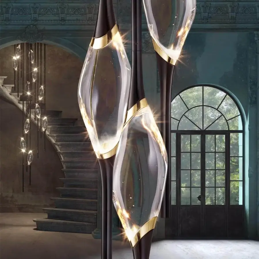 Captivating Il Pezzo Mancante Il Pezzo 12 suspension lamp crafted in clear crystal teardrop diffusers with gold-colored brass rings