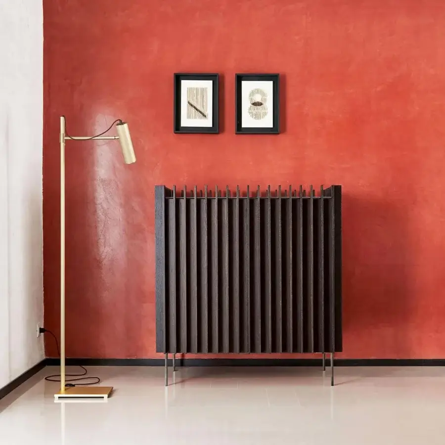 Elegant Presotto Kengo cupboard with dark brown wood slats and a contrasting lacquered interior, built with slender metal legs and a textured matte finish