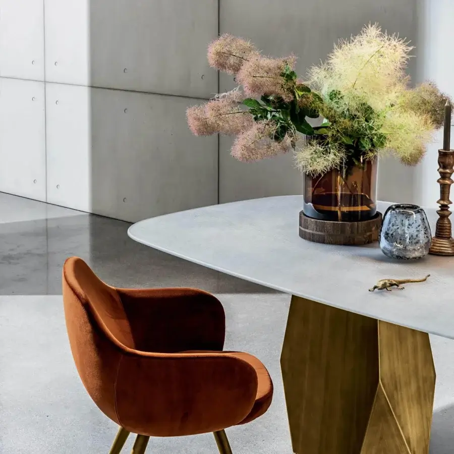 Lavish Sovet Italia Cadira armchair with rich brown textile upholstery and golden lacquered coned legs