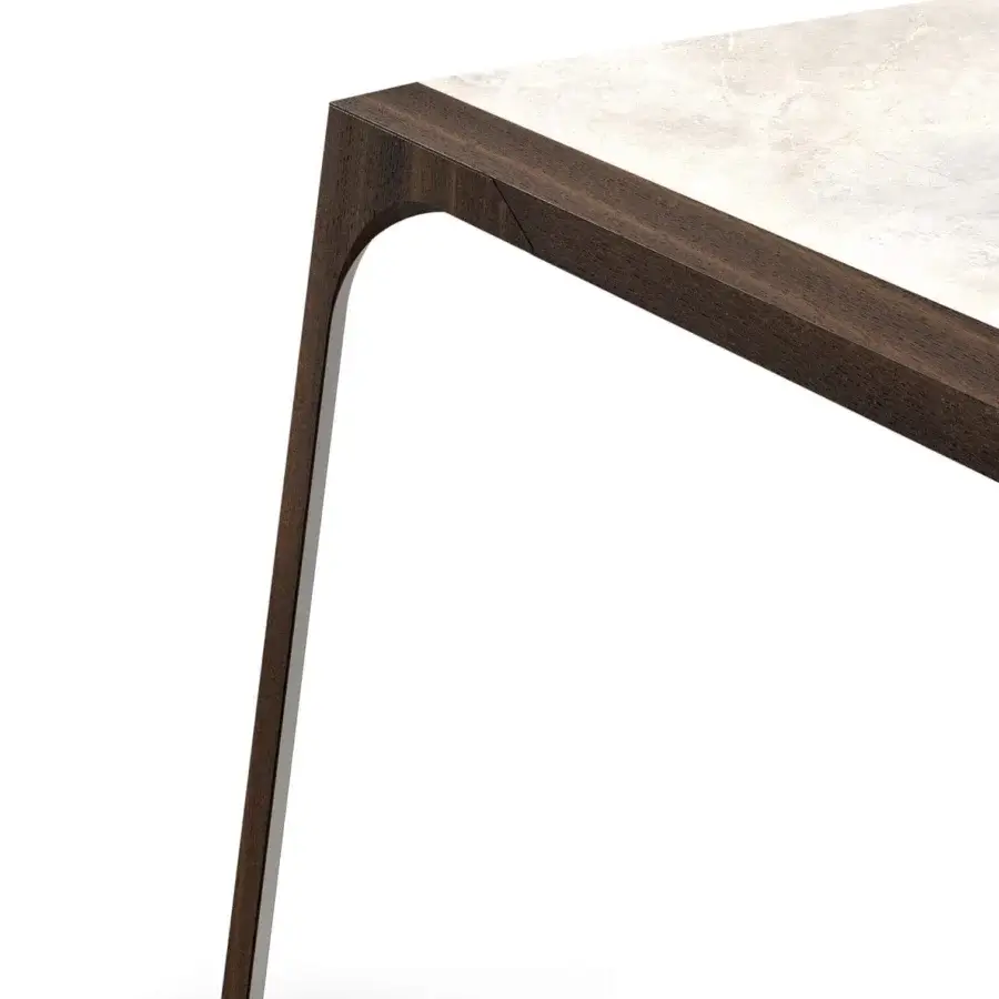 Distinguished Presotto Relevè table with a dark oak leg resembling a dancer’s pose and light stone-like surface built in Italy
