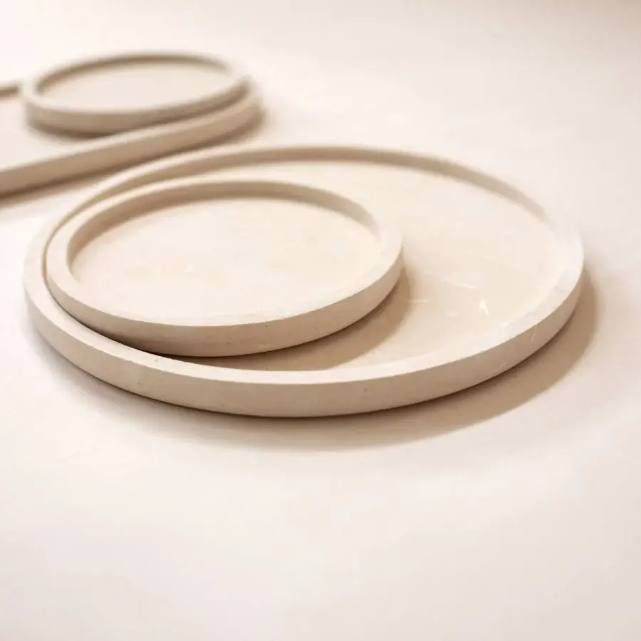 Luxury Pimar Messapo decorative tray in natural stone with matte textured off-white finish and curved overlapping forms