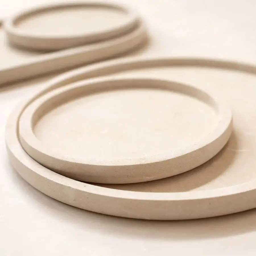 Luxury PIMAR Messapo trays in natural stone with a matte porous finish showcasing minimalist circular modular aesthetics