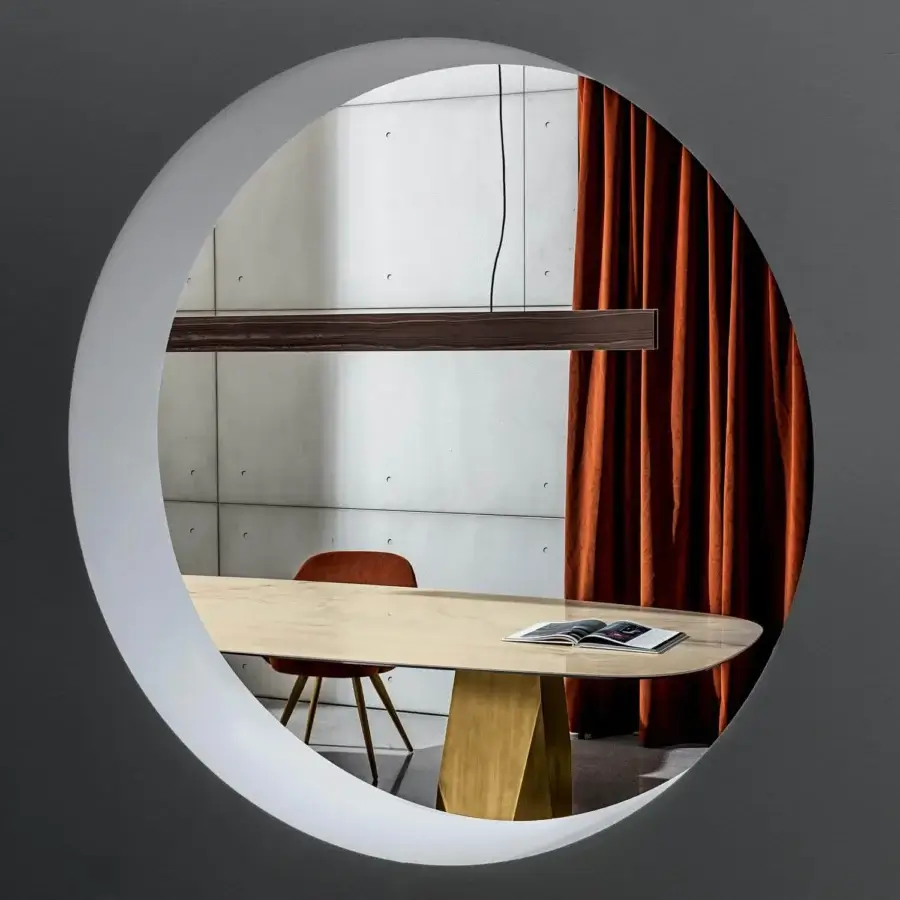 Elegant Sovet Italia Deod table with gold lacquered metal bases supporting a beige marble-like ceramic oval tabletop