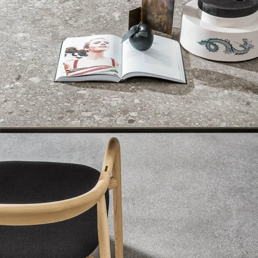 Exclusive Sovet Italia Kodo table with expansive speckled gray ceramic top and refined aluminum structure in matte finish