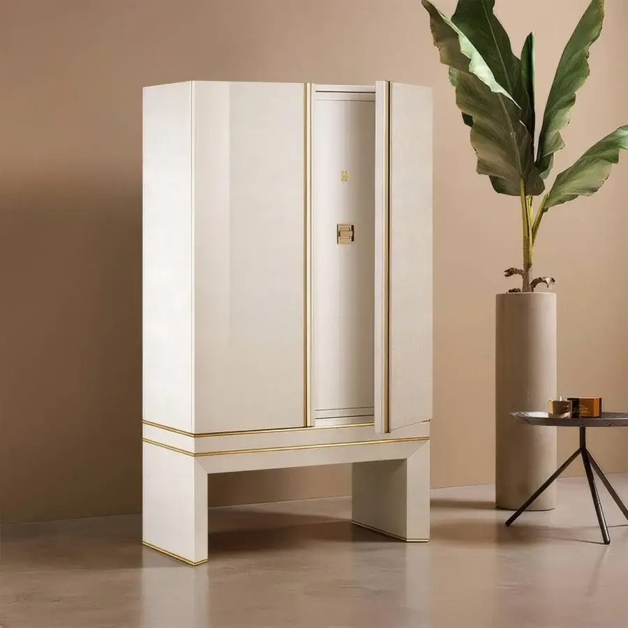 Sophisticated Agresti Lei Lui armoire featuring biometric safe and radiant gold hardware on off-white matte exterior