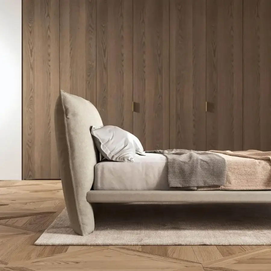Superior Presotto Fez bed with neutral fabric upholstery, curved padded headboard and sleek metal feet