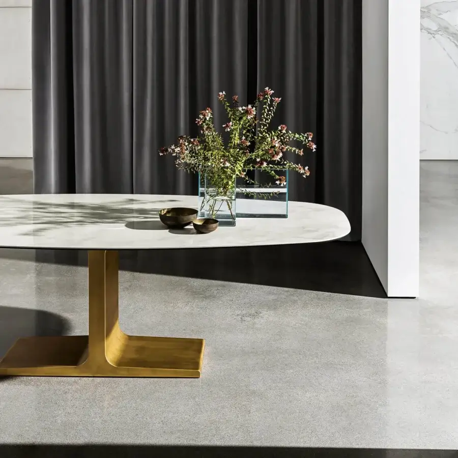 Distinguished Sovet Italia Palace table with lacquered metal base in matte gold and laminated ceramic top displaying a marble-like appearance