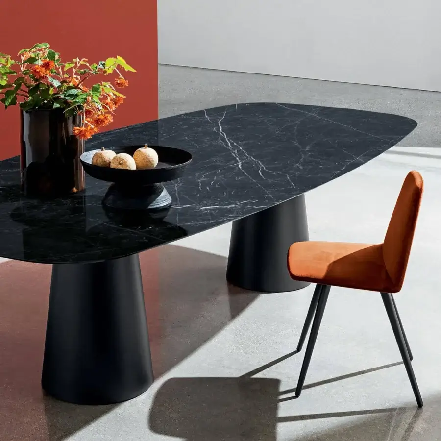 Distinguished Sovet Italia Totem Two Bases table with shaped ceramic laminated top and lacquered metal bases in a dark finish