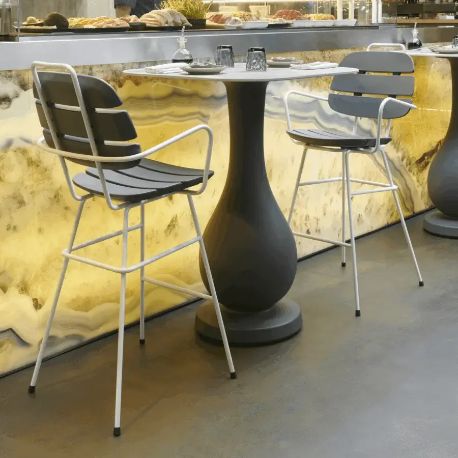 Sophisticated Slide Ribs Up high stool featuring a matte white tubular metal frame and dark grey synthetic seat