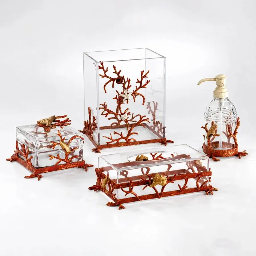 Luxury Selezioni Domus Corallo bathroom set in transparent containers with reddish-orange gold sculptural coral motifs