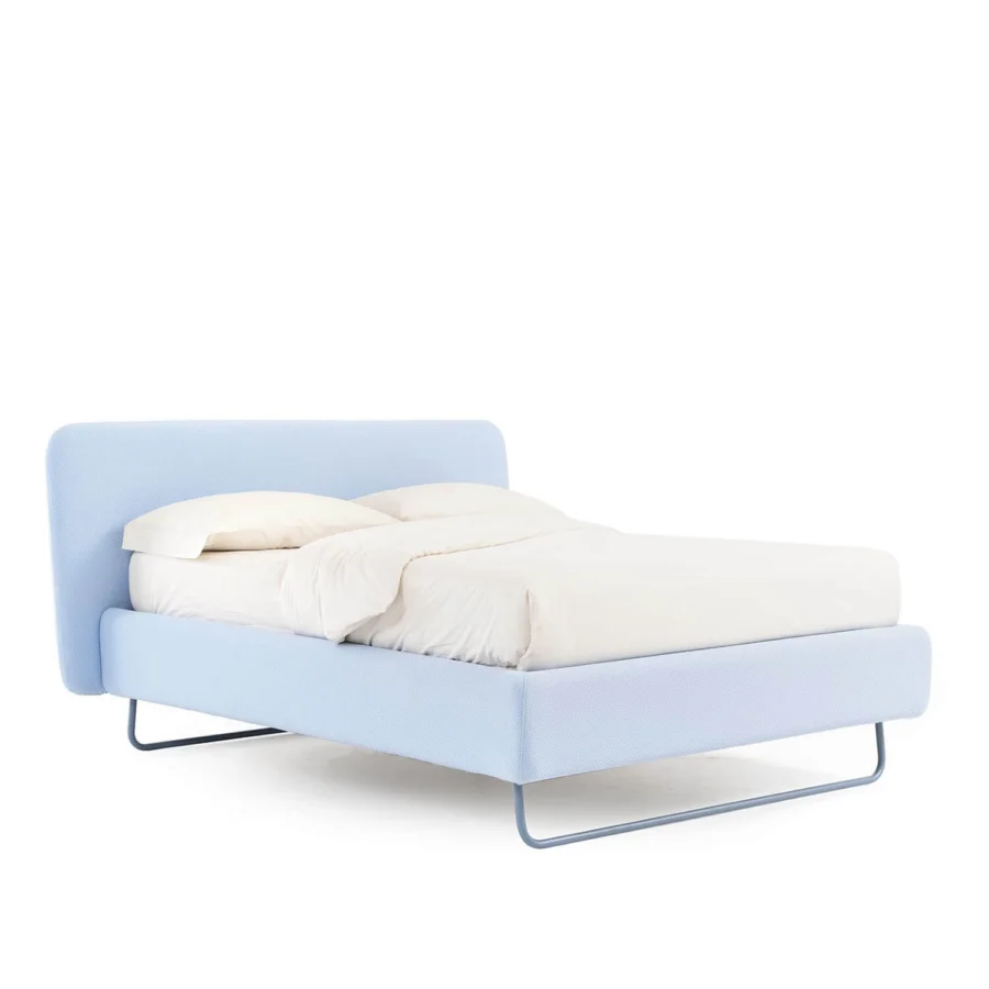 Elegant Noctis Doxy Wide bed in light blue textile upholstery featuring rounded headboard and metal base