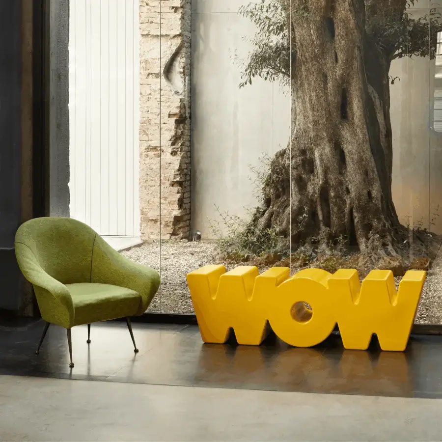 Exclusive Slide Wow Bench in vibrant yellow polyethylene with glossy finish