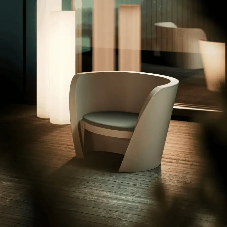 Luxury Slide Rap Lounge Chair in off-white polyethylene shell with dark grey charcoal textile cushion