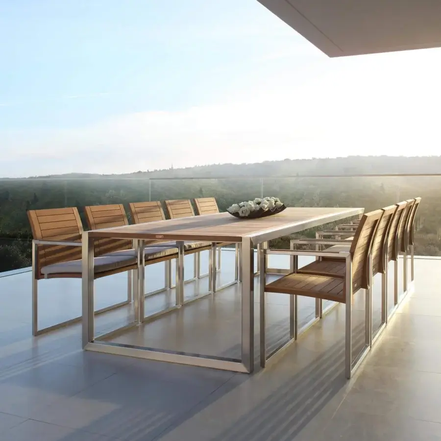 Distinguished Royal Botania Ninix table with a sleek rectangular tabletop and brushed stainless steel frame crafted in natural wood tone