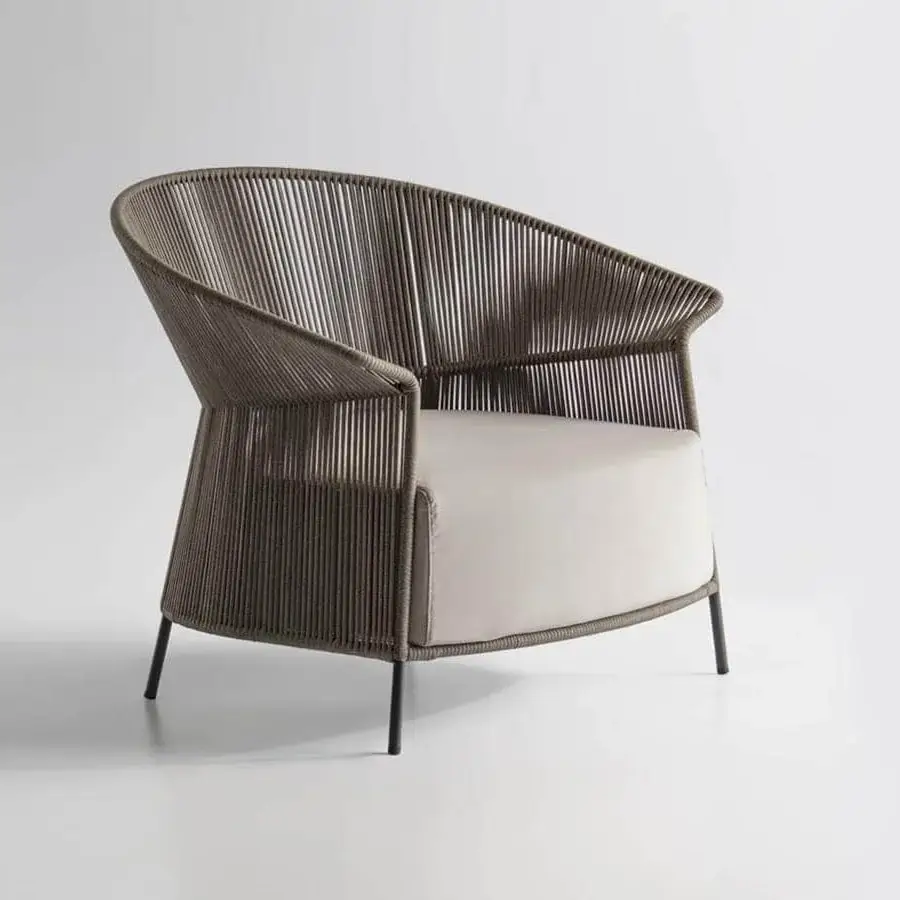 Captivating Potocco Ola lounge chair with woven medium brown “Fly” ribbon back and light cream cushion in dark matte metal
