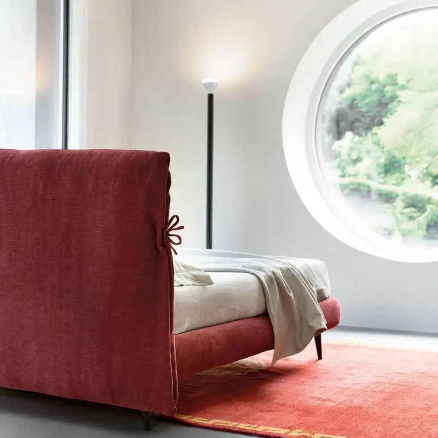 Sophisticated Noctis Eden Advance bed featuring woven red textile upholstery and soft enveloping headboard with fabric knots