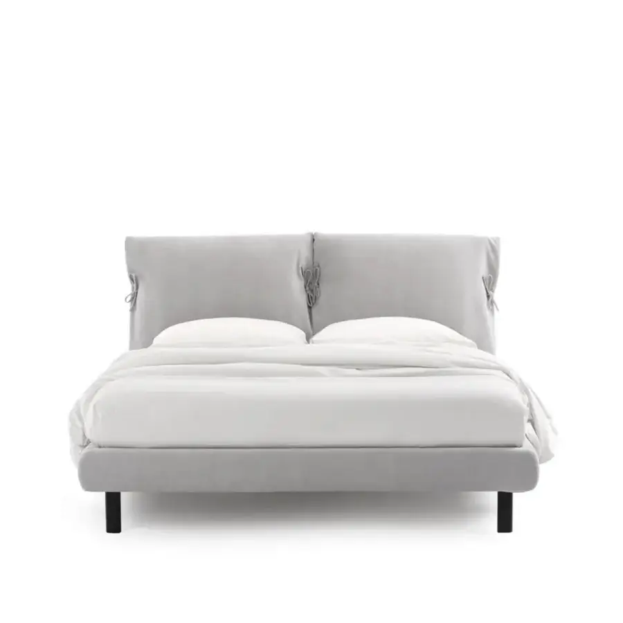Elegant Noctis Eden Advance bed featuring dual-cushion upholstered headboard in soft light grey fabric with decorative bows