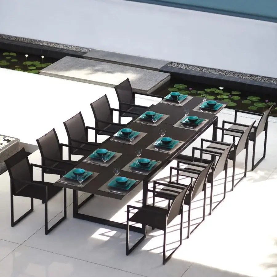 Superior Royal Botania Ninix table with a sleek metal frame and dark matte finish for luxurious outdoor dining