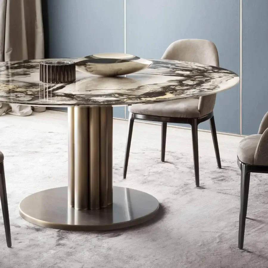 Exceptional Rugiano Forest round table with a marble top displaying black, white and gold tones, built with a brushed bronze finished base