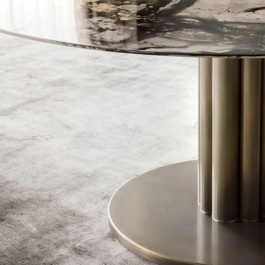 Exclusive Rugiano Forest round table with glossy gold welded tubes supporting a round glass top in black, white, and gold marble pattern