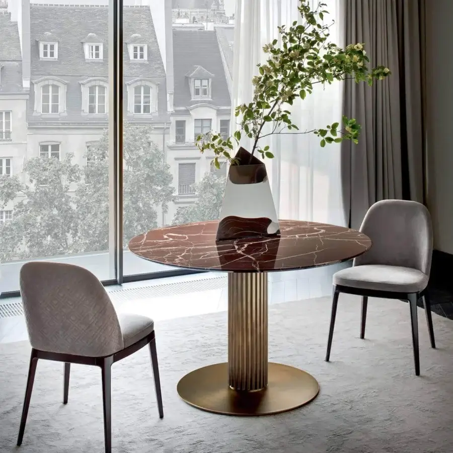 Elegant Rugiano Liberty table with bronze-finished aluminum base and swirling brown marble surface displaying glossy finishes