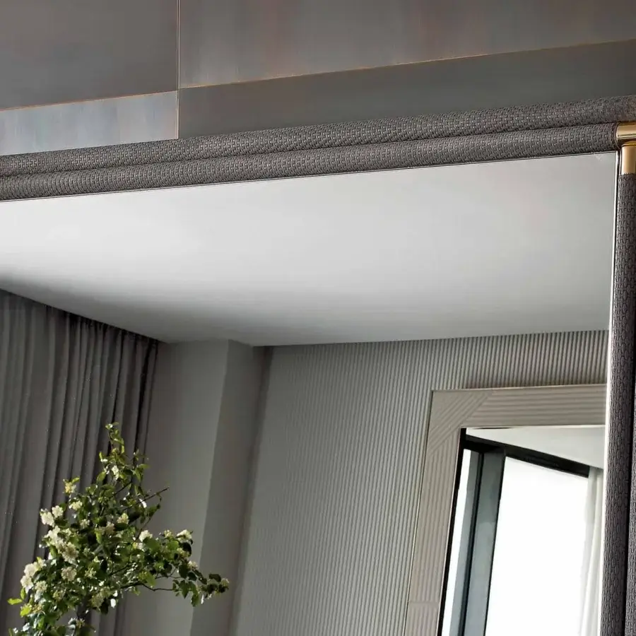 Refined Rugiano Boheme mirror with bronze metal structure and medium gray woven textile covering, accented with gold-colored fittings