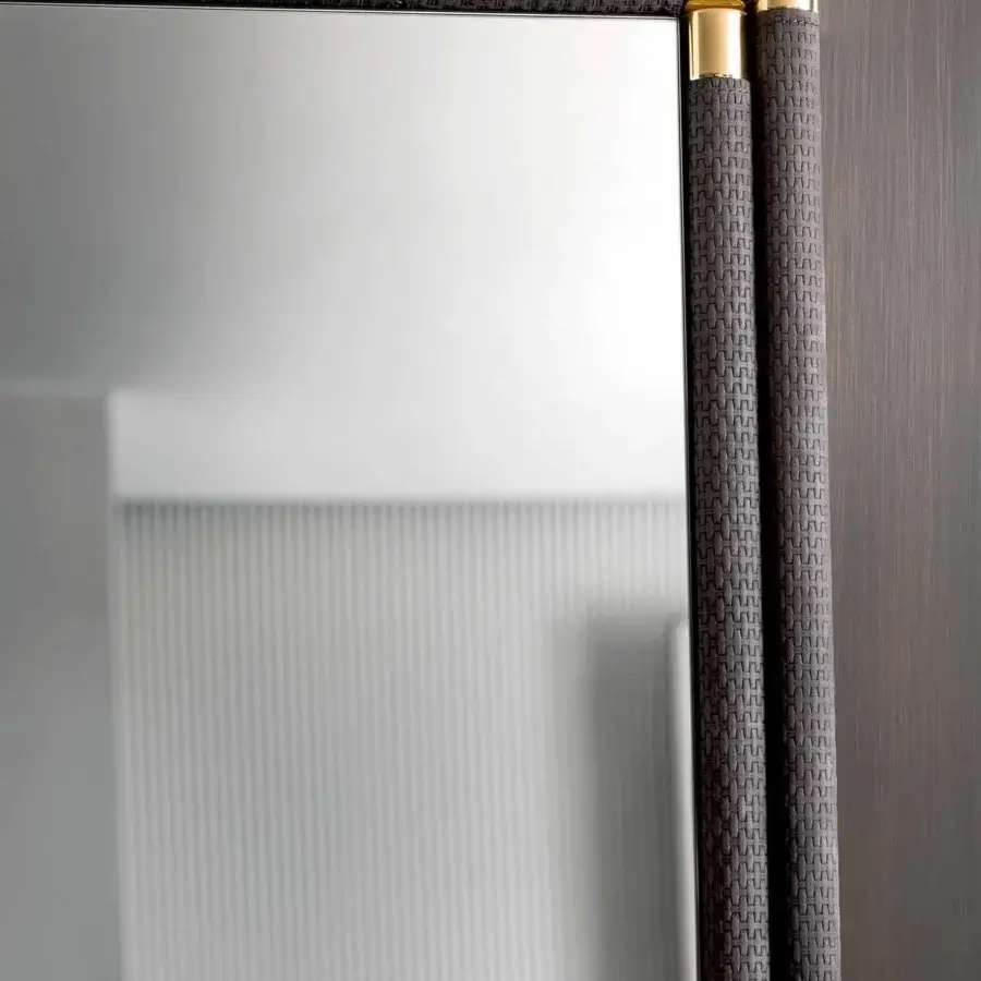 Distinguished Rugiano Boheme mirror with dark gray woven leather and gold cylindrical metallic accents in a bronze metal structure