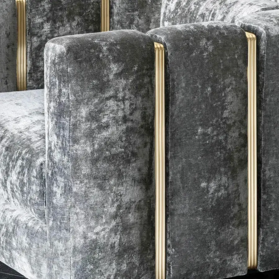 Innovative Rugiano Club lounge chair in dark gray textile with brushed brass vertical accents and drawn tube structure
