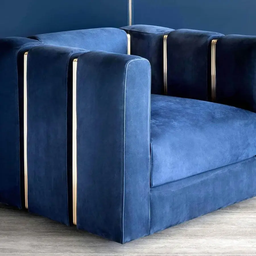 Distinguished Rugiano Club lounge chair in deep blue textile with matte finish and refined brushed brass tubes