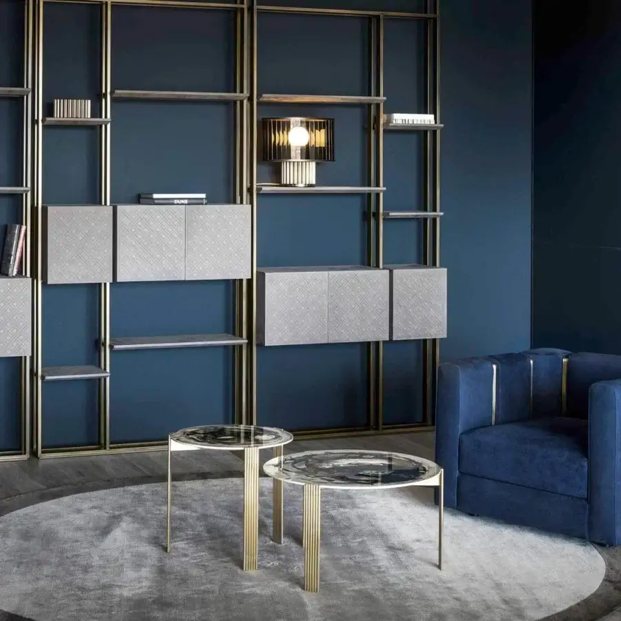 Exclusive Rugiano Club lounge chair in deep blue textile with refined brushed brass tubes creating a stylish vertical pattern
