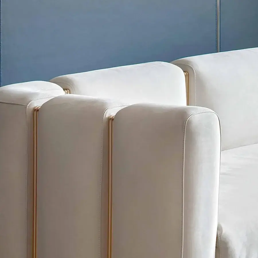 Elegant Rugiano Club sofa crafted in light cream textile with matte finish and innovative brushed brass tubes