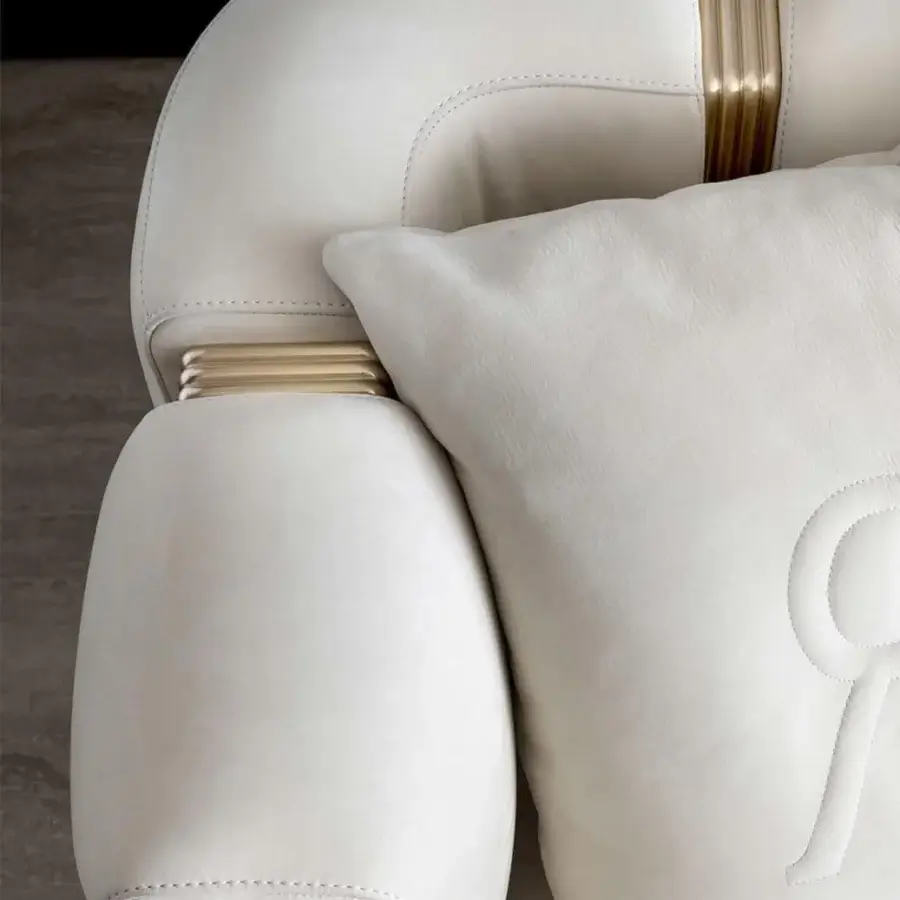 Distinctive Rugiano Club sofa crafted in plush off-white leather with refined brushed brass tubes and visible stitching