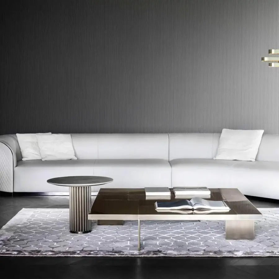 Distinguished Rugiano Pierre sectional with bronze metal base and glossy dark tabletop crafted with metallic accents