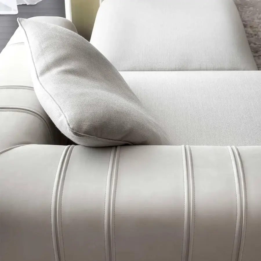 Captivating Rugiano Luz sectional upholstered in light gray textile with brushed brass detailing and synthetic backrest