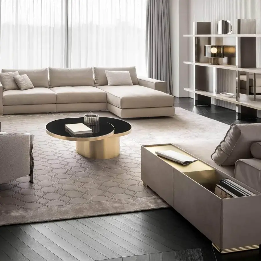Elegant Rugiano Nautilus sectional upholstered in muted beige textile with smooth matte accents of brushed brass metal