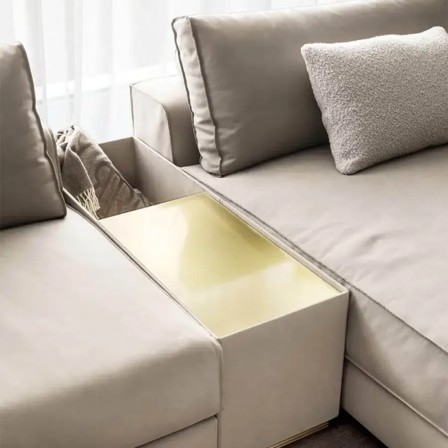 Distinguished Rugiano Nautilus sectional upholstered in light beige textile with smooth finish and brushed brass metal accents