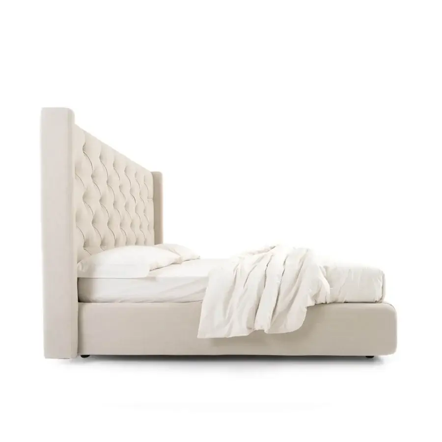 Exquisite architectural Noctis Star bed in textured off-white fabric featuring deep diamond tufting and winged sides