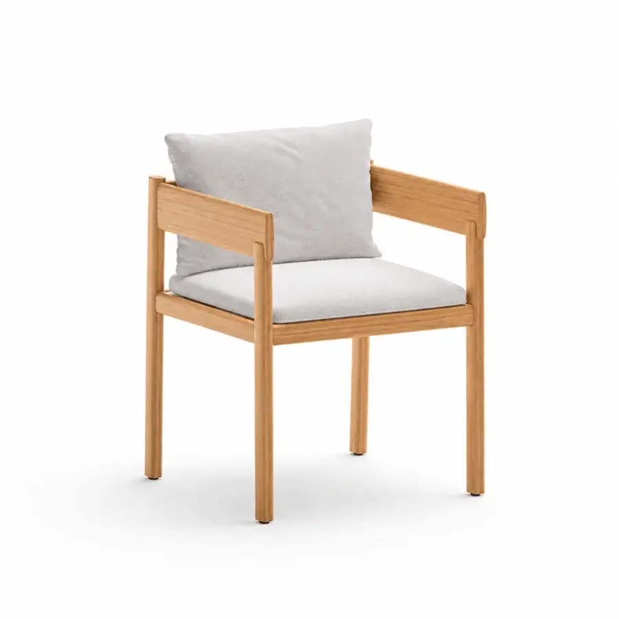 Luxury Unopiù Cora chair crafted from solid teak in smooth matte finish with angular silhouette plus light textile cushions